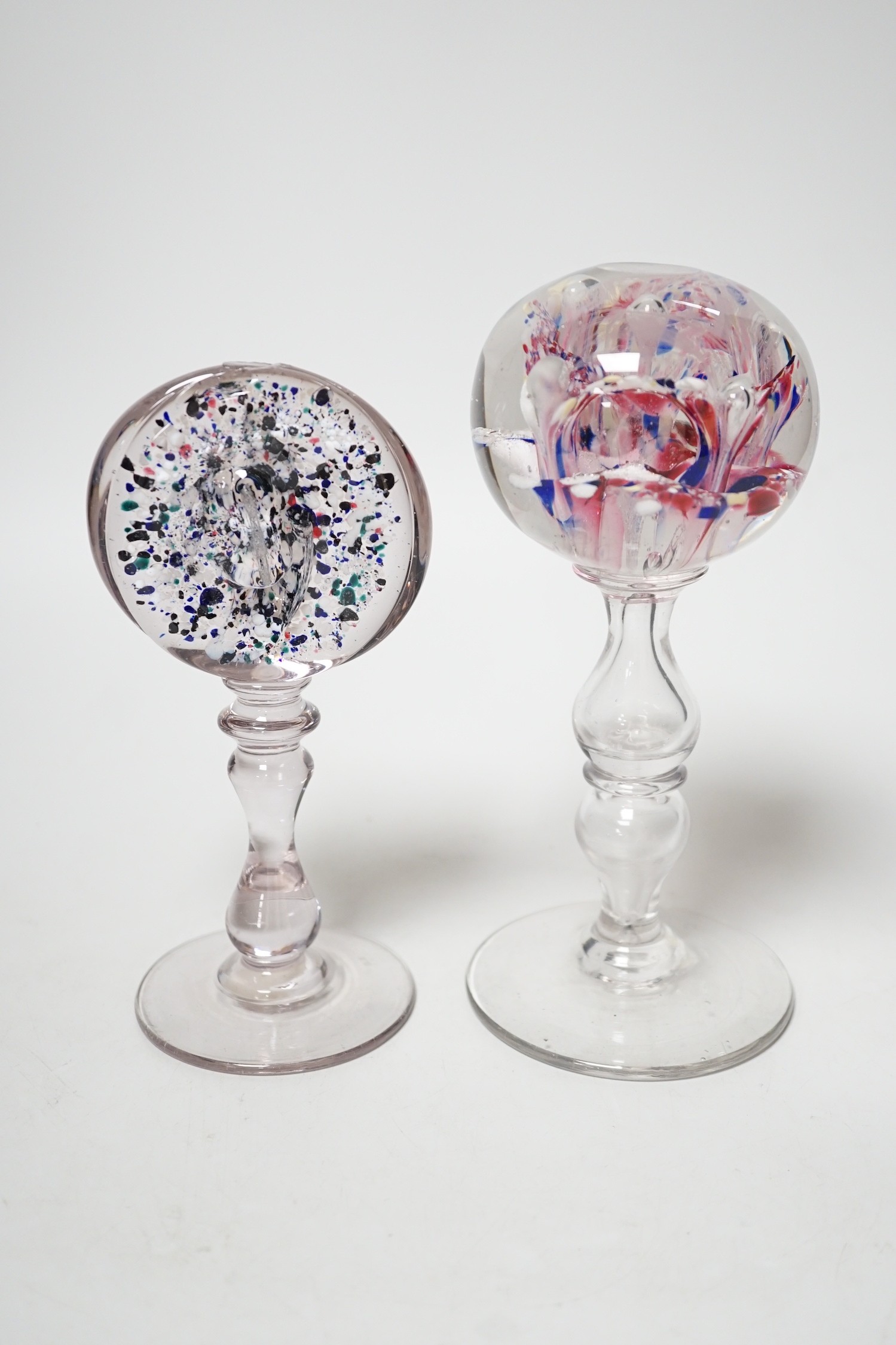 Two 19th century glass pedestal ornaments, one possibly a wig stand, the other containing a sulphide of Saint John the Baptist, Tallest 20cm